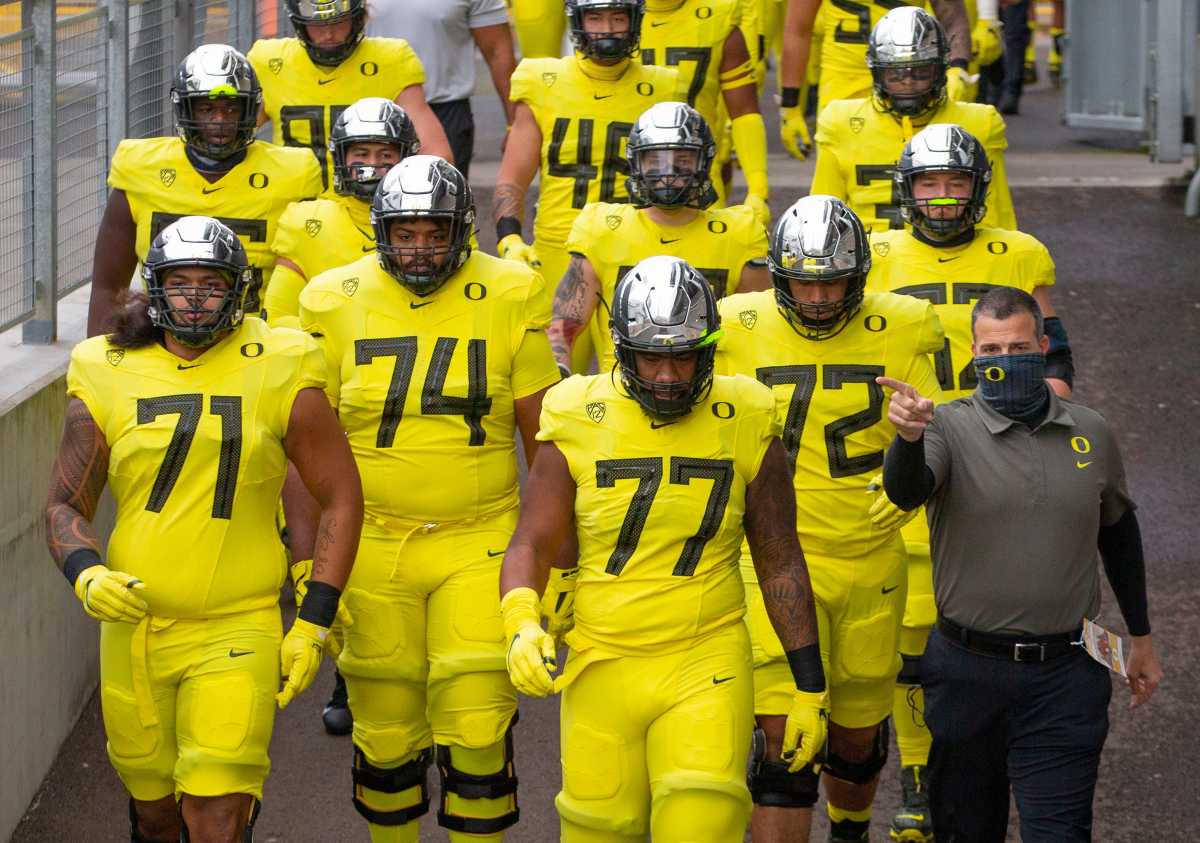 Mario Cristobal and the offensive line walking into battle against Oregon State.